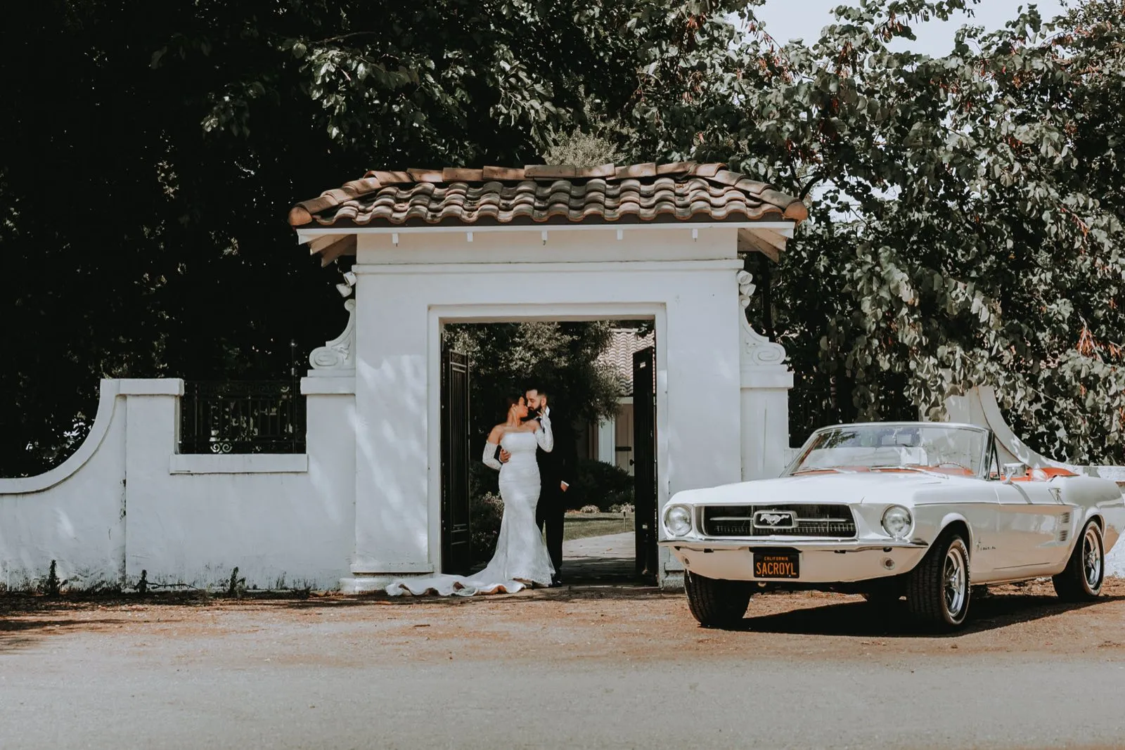 Luxury vehicle arriving at a Sacramento wedding venue